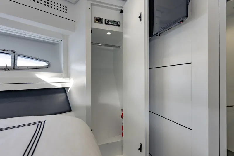 Slide: The Image of Interior of 2010 Pershing 80 yacht cabin with open closet and window. - 66