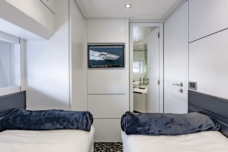 Slide: The Image of Luxurious interior of 2010 Pershing 80 yacht with twin beds and modern decor. - 70