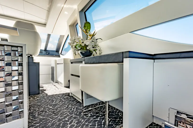 Slide: The Image of Luxurious interior of a 2010 Pershing 80 yacht with modern design and elegant decor. - 36