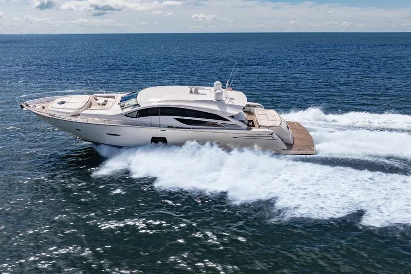 Slide: The Image of Luxurious 2010 Pershing 80 yacht cruising swiftly on open sea waters. - 4