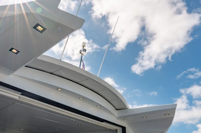 Slide: The Image of Luxury Pershing 80 yacht exterior against a bright blue sky, 2010 model. - 24