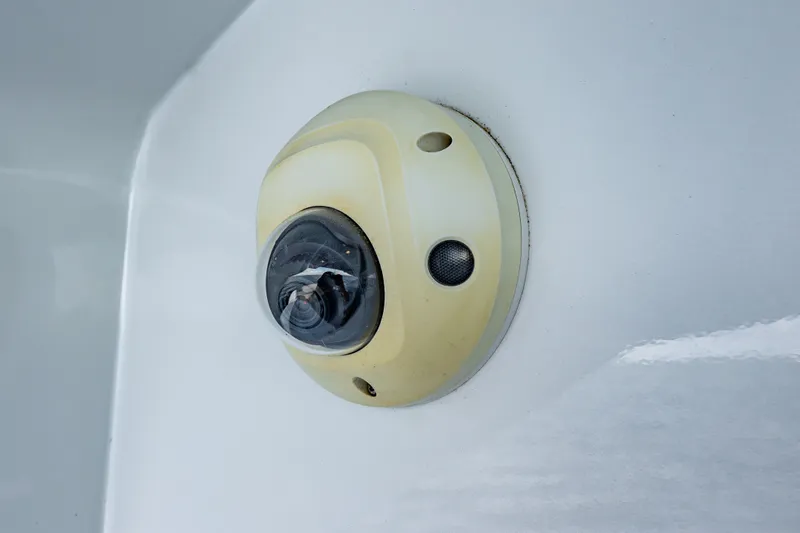 Slide: The Image of Security camera on a 2010 Pershing 80 yacht, mounted on a white surface. - 28