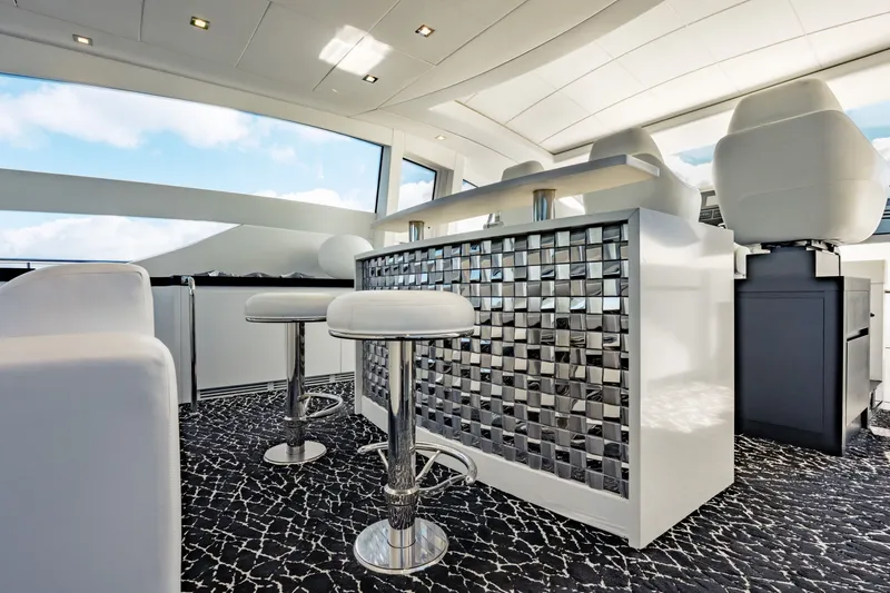 Slide: The Image of Luxurious interior of 2010 Pershing 80 yacht with modern bar and seating. - 37