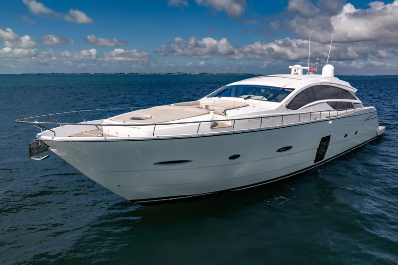 Slide: The Image of Luxurious 2010 Pershing 80 yacht cruising on open water under a clear blue sky. - 13