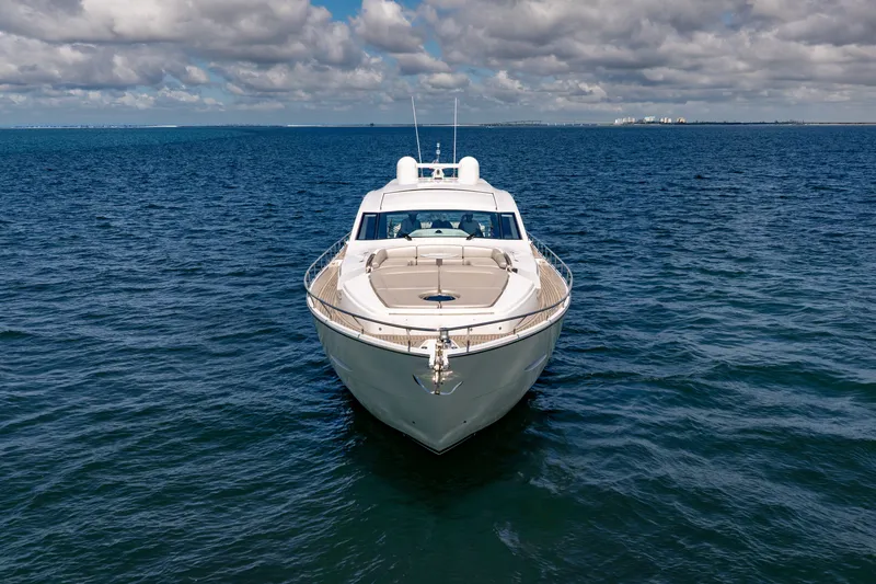 Slide: The Image of Front view of a 2010 Pershing 80 yacht on open water under cloudy skies. - 12