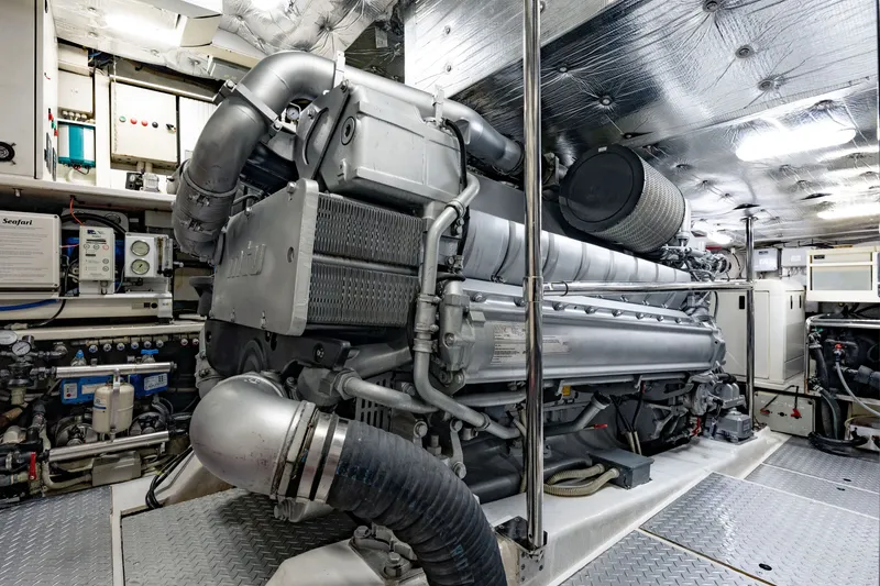 Slide: The Image of Engine room of a 2010 Pershing 80 yacht, showcasing advanced machinery and equipment. - 95