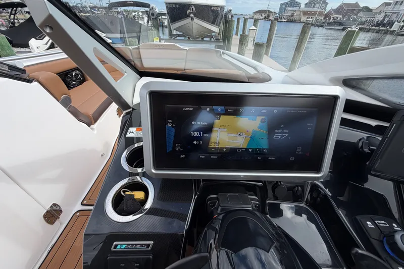 Slide: The Image of Dashboard of 2025 Yamaha Boats 275SD with touchscreen navigation and controls. - 24