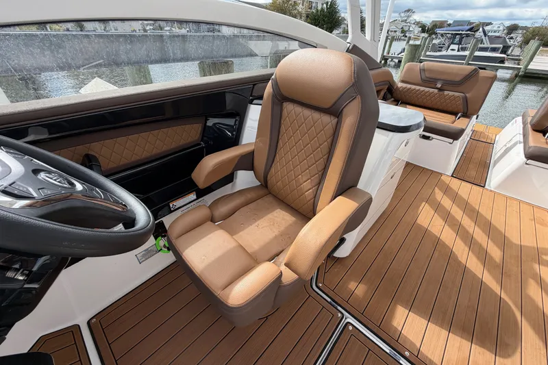 Slide: The Image of Luxurious interior of 2025 Yamaha Boats 275SD with premium seating and elegant wood flooring. - 21