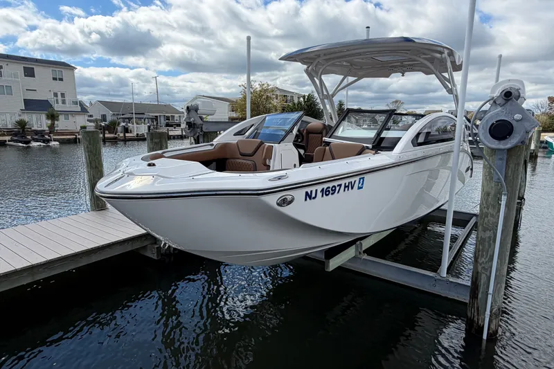Slide: The Image of 2025 Yamaha Boats 275SD docked, showcasing sleek design and modern features. - 3