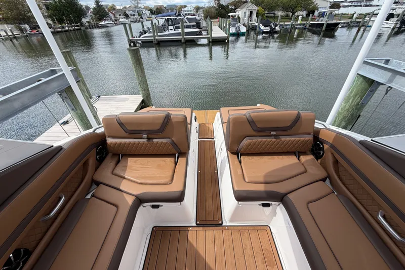 Slide: The Image of Luxurious interior of 2025 Yamaha Boats 275SD with elegant seating and waterfront view. - 11