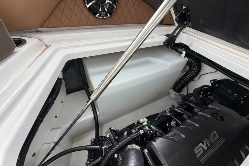Slide: The Image of Engine compartment of 2025 Yamaha Boats 275SD, showcasing SVHO engine and storage area. - 36