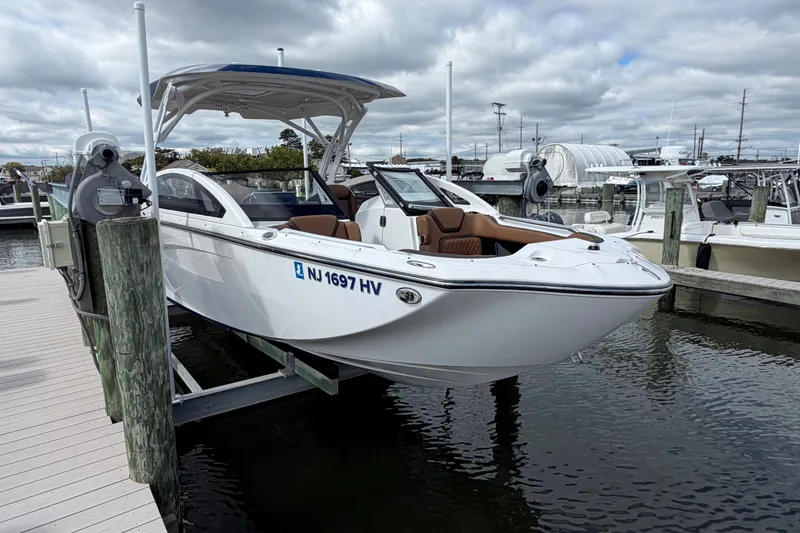 Slide: The Image of 2025 Yamaha Boats 275SD docked, showcasing sleek design and modern features. - 6