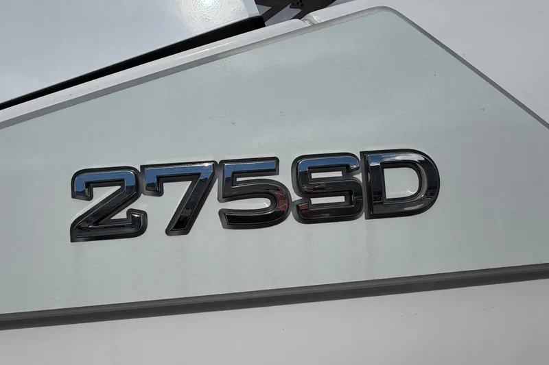 Slide: The Image of 2025 Yamaha Boats 275SD model emblem on a sleek white surface. - 39