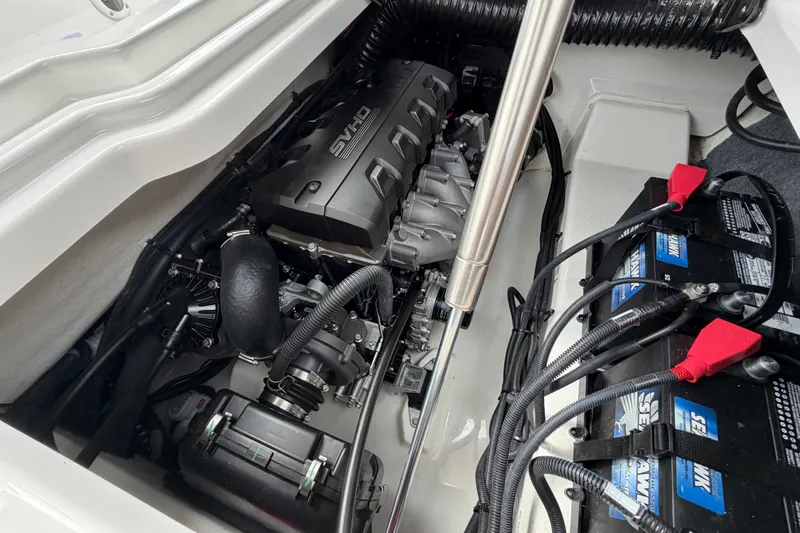 Slide: The Image of Engine compartment of 2025 Yamaha Boats 275SD, showcasing powerful motor and battery setup. - 35