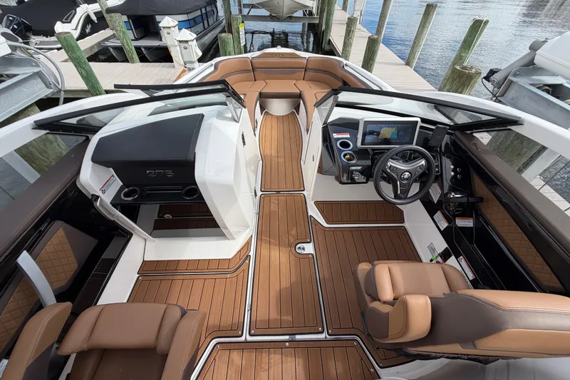 Slide: The Image of 2025 Yamaha Boats 275SD interior with sleek design, modern dashboard, and luxurious seating. - 25