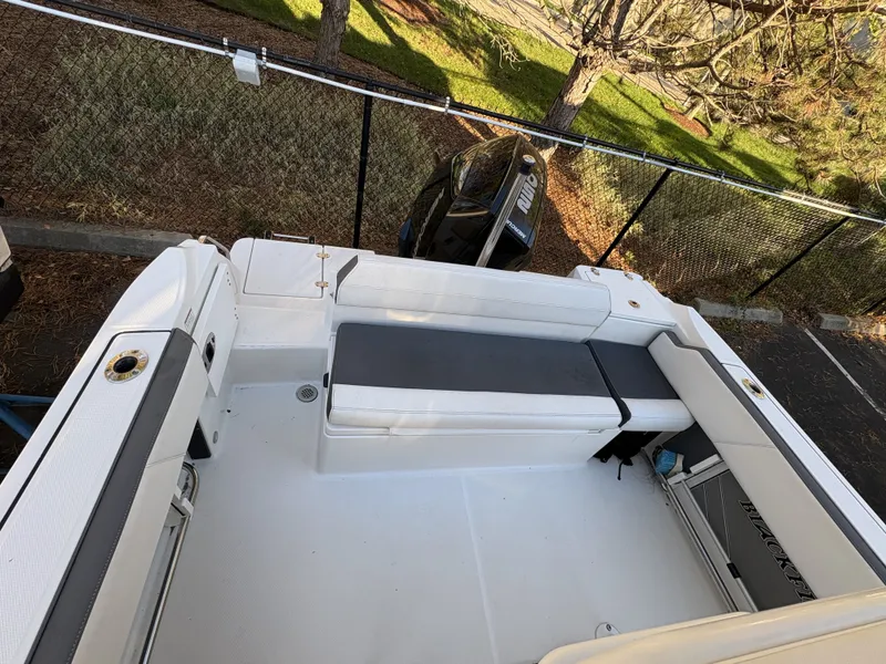 Slide: The Image of The image shows the cockpit of a 2019 Blackfin 212 CC boat with gray upholstery. - 8