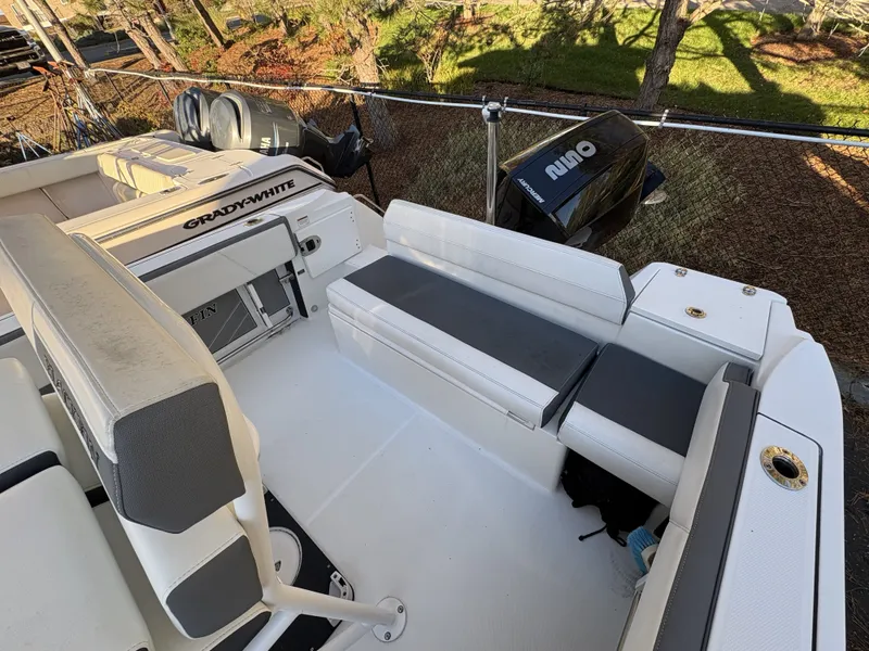 Slide: The Image of The image shows the cockpit of a 2019 Blackfin 212 CC boat with white and gray seating. - 7