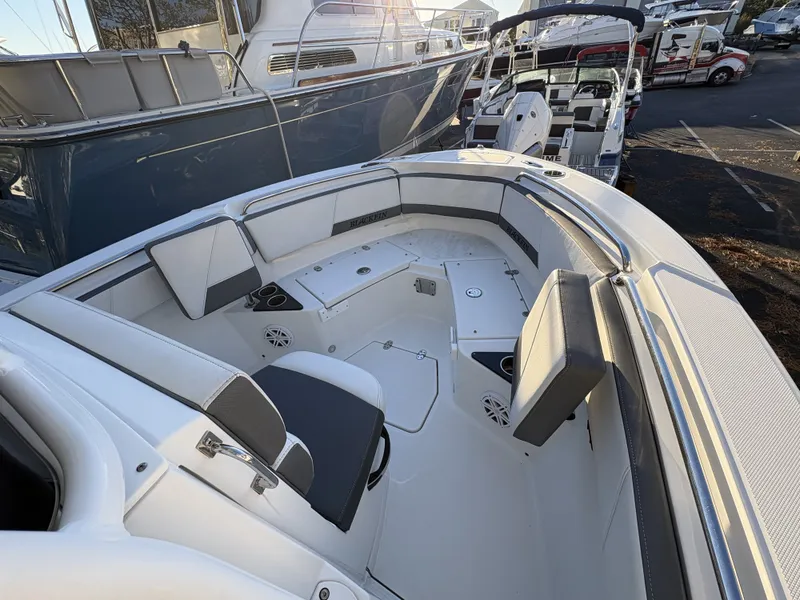 Slide: The Image of The image shows the cockpit of a 2019 Blackfin 212 CC boat with gray and white upholstery. - 18