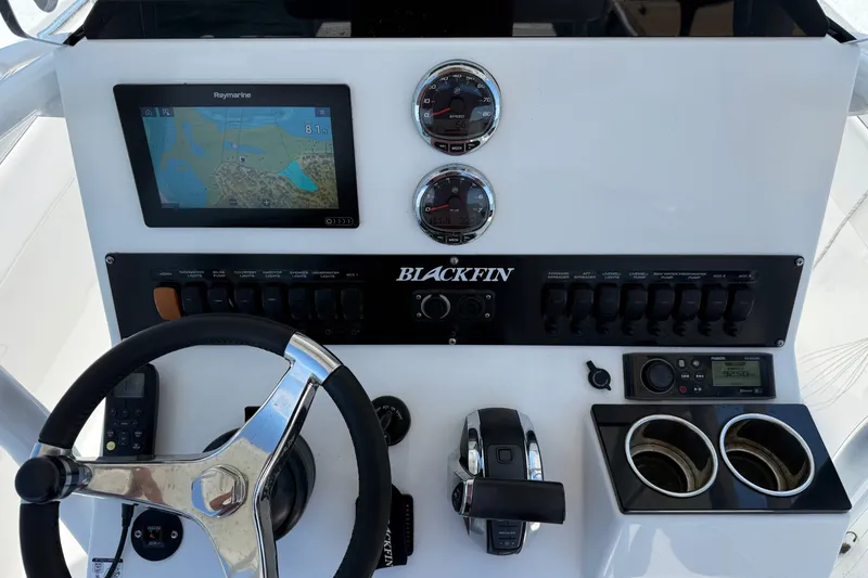 Slide: The Image of 2019 Blackfin 212 CC boat dashboard with navigation system and controls. - 6