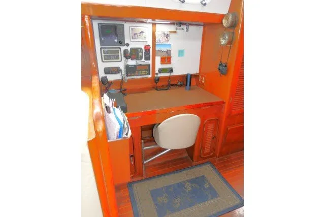 Slide: The Image of Navigation station in 1986 Tayana 52 Center Cockpit yacht with equipment and chair. - 15