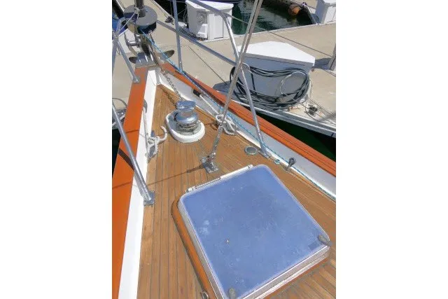 Slide: The Image of 1986 Tayana 52 Center Cockpit sailboat deck with winch and hatch. - 65