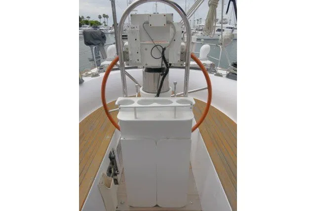 Slide: The Image of 1986 Tayana 52 Center Cockpit helm with wooden deck and navigation equipment. - 51
