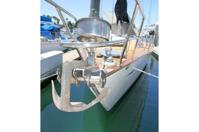 Slide: The Image of 1986 Tayana 52 Center Cockpit sailboat with anchor, docked in marina. - 69
