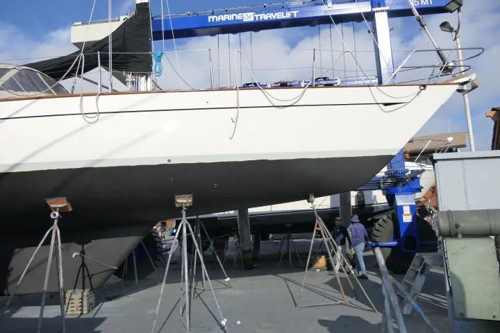 Slide: The Image of 1986 Tayana 52 Center Cockpit sailboat on stands in a boatyard. - 71