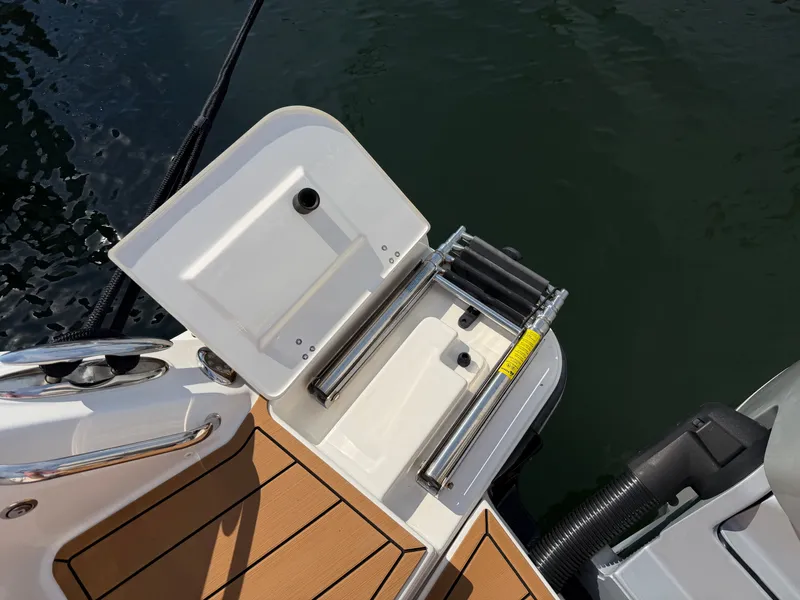 Slide: The Image of The 2024 Boston Whaler 405 Conquest swim platform with a foldable ladder. - 18