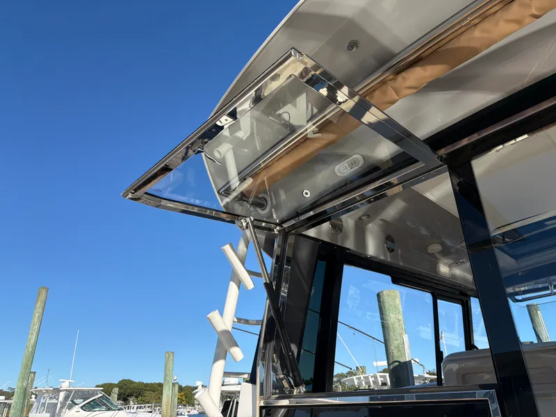 Slide: The Image of The 2024 Boston Whaler 405 Conquest features a sleek design with a pop-up window. - 37