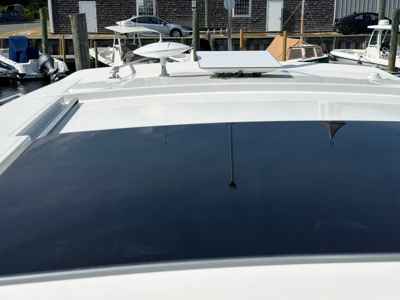 Slide: The Image of The image shows the roof of a Boston Whaler 405 Conquest boat with a large sunroof. - 44