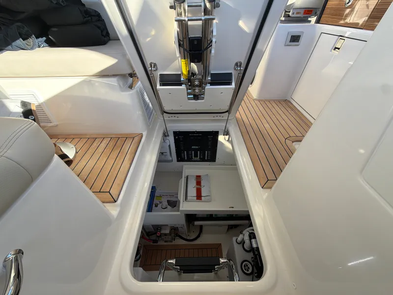 Slide: The Image of The image shows the engine room of a 2024 Boston Whaler 405 Conquest with a clean, modern design. - 45
