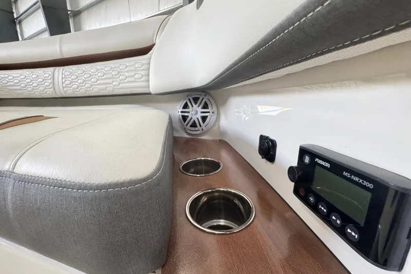 Slide: The Image of Interior of 2021 Tiara Sport 38 LS boat with luxurious seating and audio controls. - 13