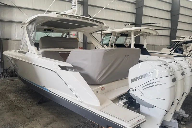 Slide: The Image of 2021 Tiara Sport 38 LS boat with Mercury outboard engines in storage facility. - 16