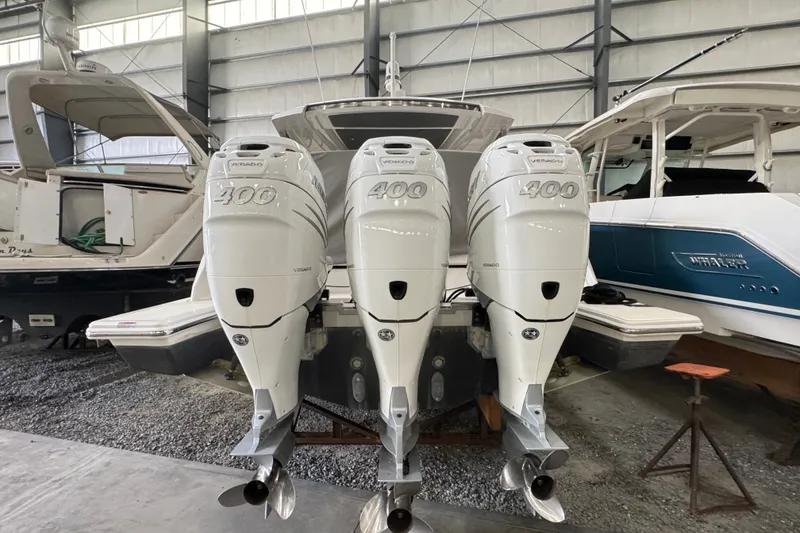 Slide: The Image of 2021 Tiara Sport 38 LS with triple 400 horsepower outboard engines in a boatyard. - 18