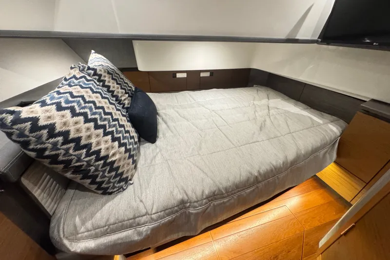 Slide: The Image of Luxurious cabin interior of 2021 Tiara Sport 38 LS with cozy bedding and stylish pillows. - 21