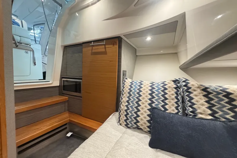 Slide: The Image of 2021 Tiara Sport 38 LS cabin interior with modern design and cozy seating. - 19