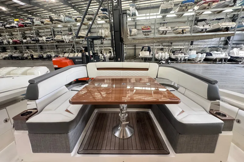 Slide: The Image of Luxurious 2021 Tiara Sport 38 LS yacht interior with elegant seating and polished wooden table. - 2