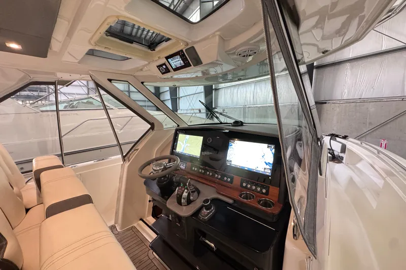Slide: The Image of Interior view of 2021 Tiara Sport 38 LS boat cockpit with modern navigation system. - 8