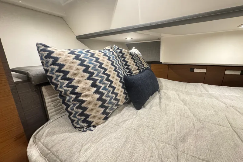 Slide: The Image of Luxurious cabin interior of 2021 Tiara Sport 38 LS with stylish pillows and bedding. - 20