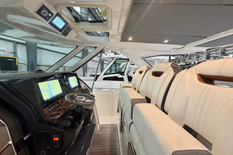 Slide: The Image of Interior view of 2021 Tiara Sport 38 LS boat with luxurious seating and advanced navigation system. - 7