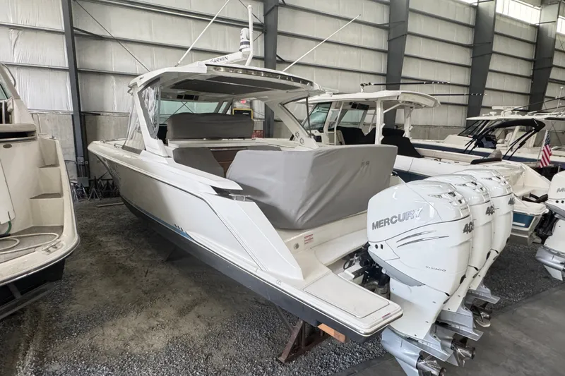 Slide: The Image of 2021 Tiara Sport 38 LS boat with Mercury engines in a storage facility. - 17