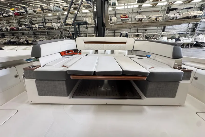Slide: The Image of 2021 Tiara Sport 38 LS boat interior with luxurious seating in a spacious marina. - 3