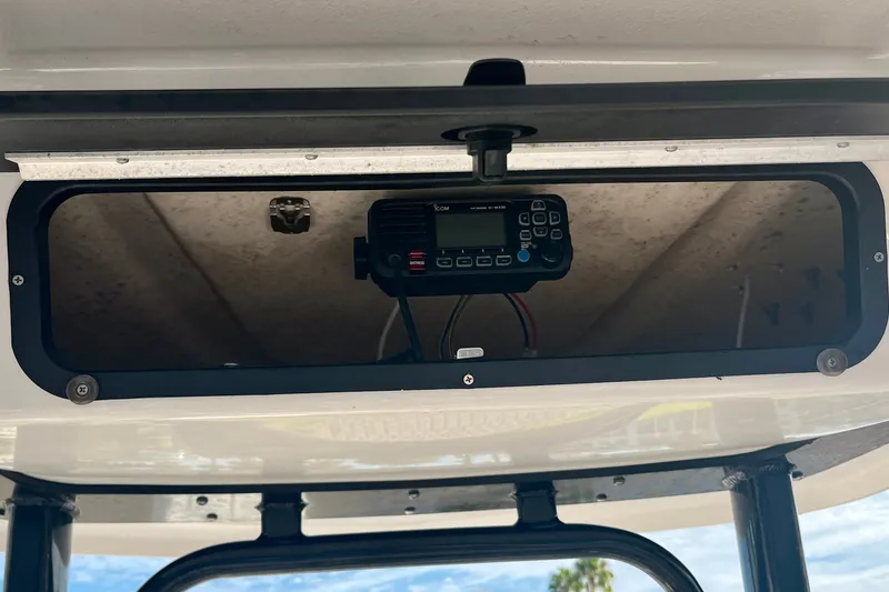 Slide: The Image of 2025 Robalo 226 Cayman boat console with mounted marine radio. - 10