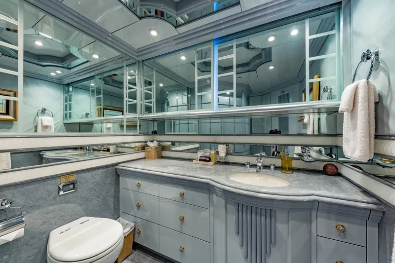Slide: The Image of Luxurious yacht bathroom with marble countertop, mirrored walls, and elegant fixtures on a 2002 Christensen Trideck. - 32
