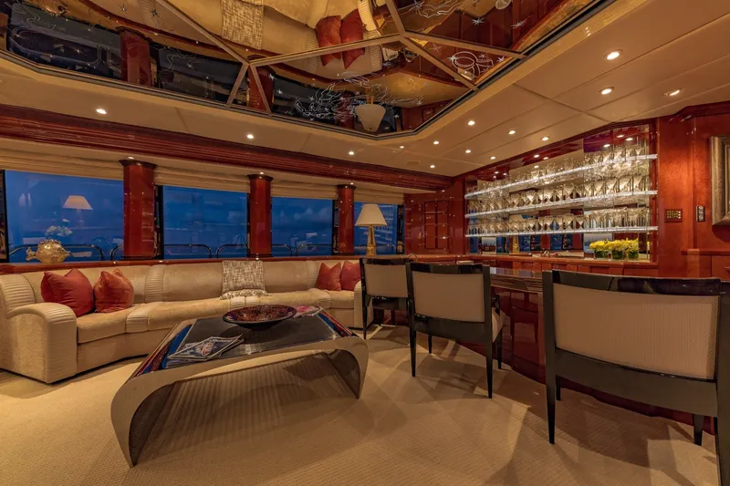 Slide: The Image of Luxurious interior of 2002 Christensen Trideck yacht with elegant seating and illuminated bar area. - 40