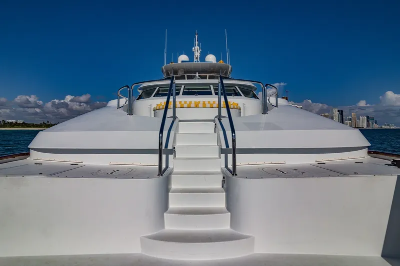 Slide: The Image of Luxurious 2002 Christensen Trideck yacht with sleek design and ocean backdrop. - 44