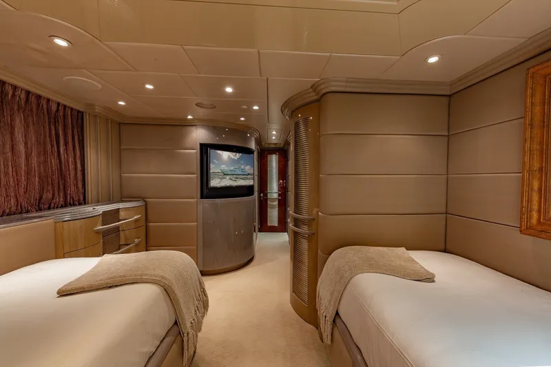 Slide: The Image of Luxurious 2002 Christensen Trideck yacht bedroom with twin beds and elegant decor. - 35