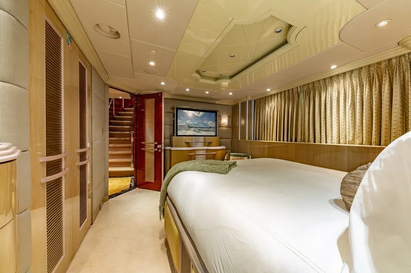 Slide: The Image of Luxurious bedroom interior on 2002 Christensen Trideck yacht with elegant furnishings. - 28