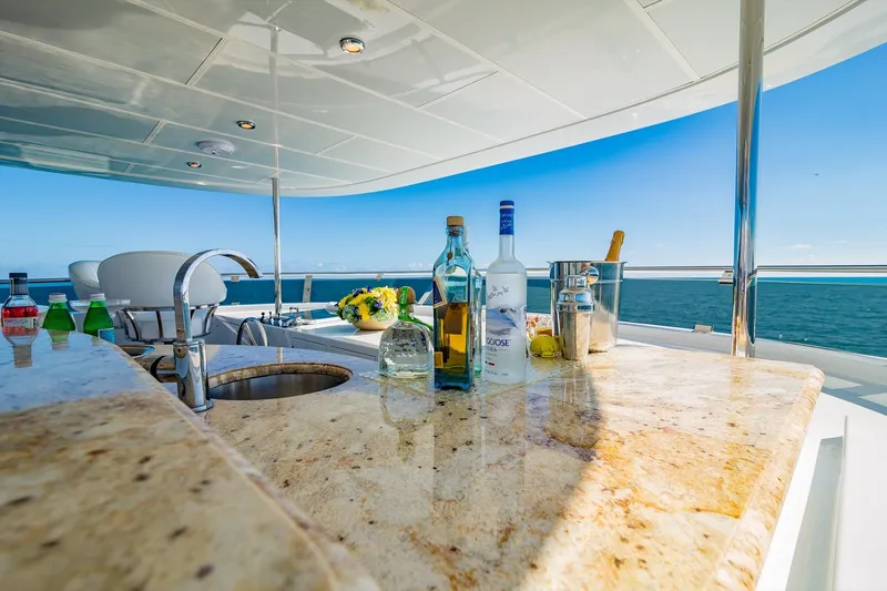 Slide: The Image of Luxurious yacht bar on 2002 Christensen Trideck with ocean view and drinks. - 48